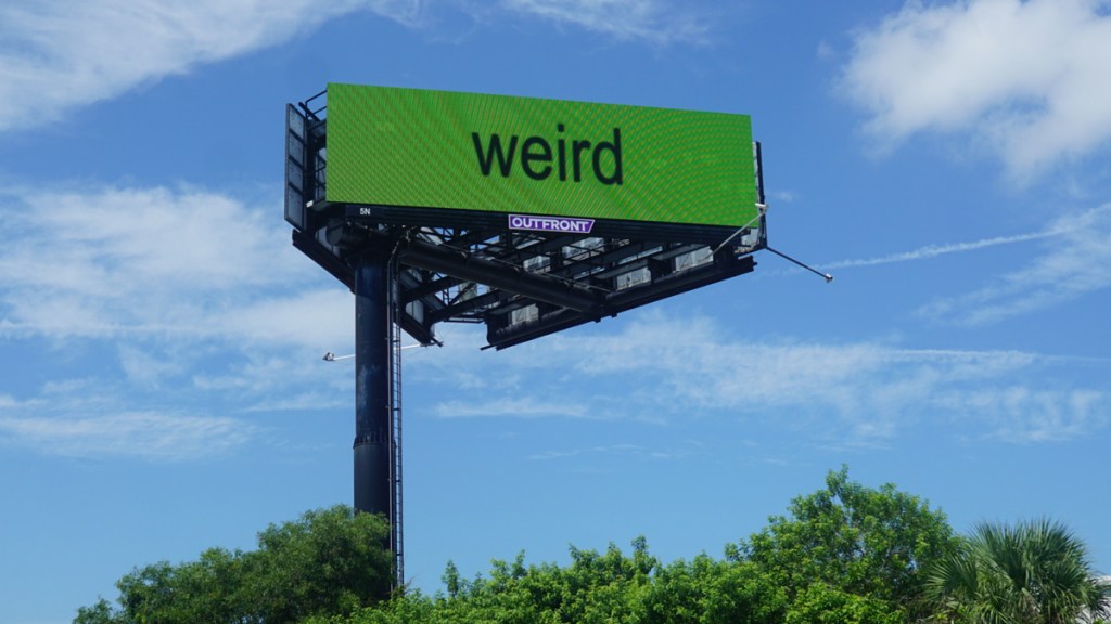 Bizarre billboard in Florida with brat green background