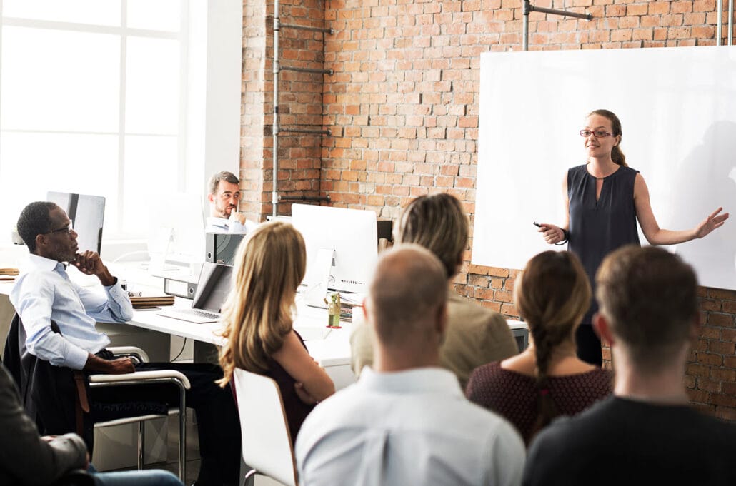 Business professionals attending a workshop for continued learning