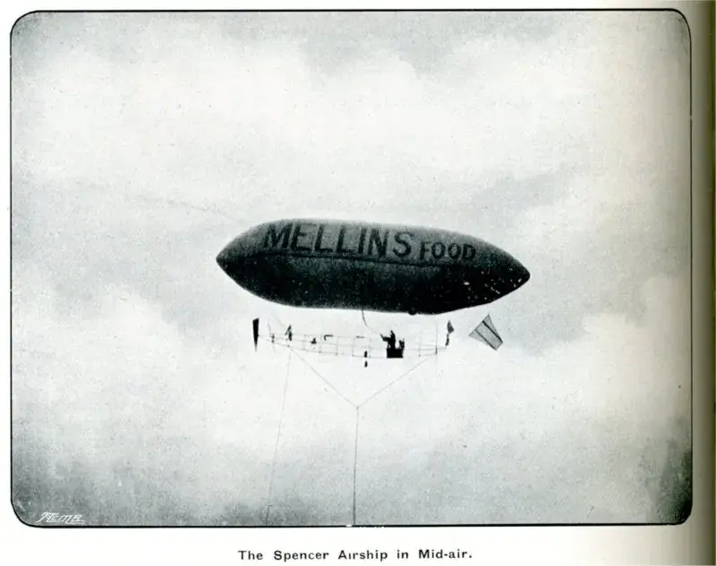 Photo of a blimp with “Mellins Food” on the side.