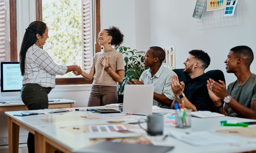 employee recognition at company meeting